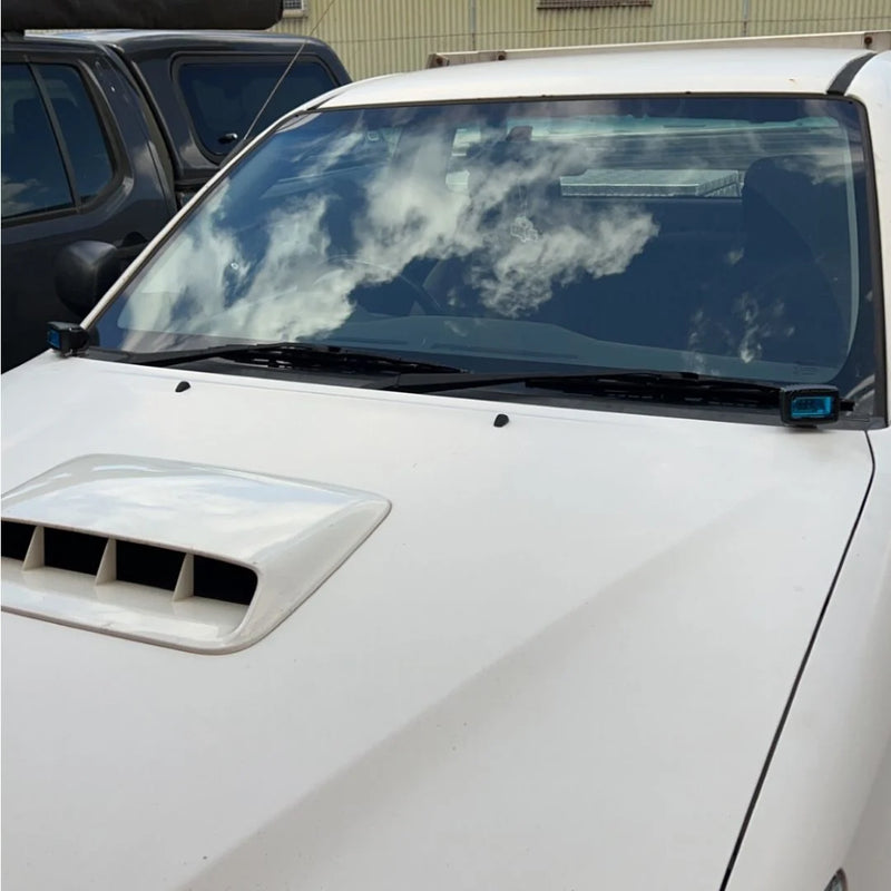 Load image into Gallery viewer, Toyota Hilux N70 with LED ditch lights mounted via Scrub King bonnet hinge brackets on outback track
