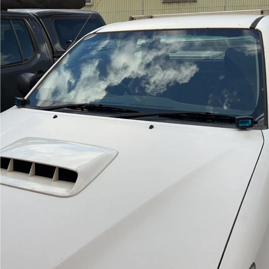 Toyota Hilux N70 with LED ditch lights mounted via Scrub King bonnet hinge brackets on outback track