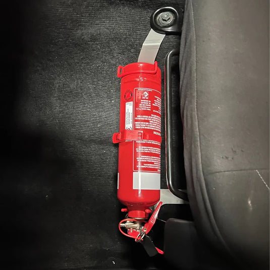 Scrub King fire extinguisher bracket mounted on Nissan Navara NP300 passenger seat rail