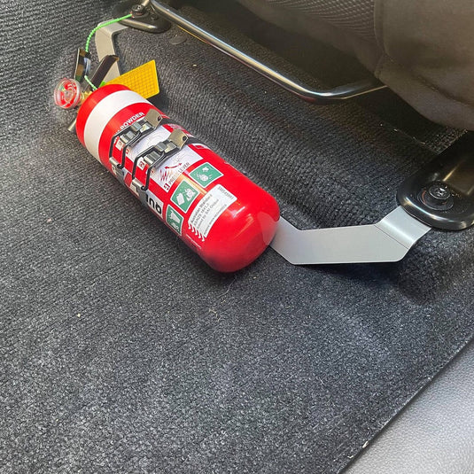 Scrub King matte black fire extinguisher bracket mounted on 2021 Isuzu MU-X passenger seat rail