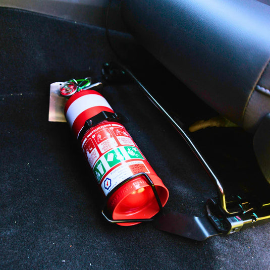 Scrub King matte black fire extinguisher bracket mounted on GWM Cannon passenger seat rail