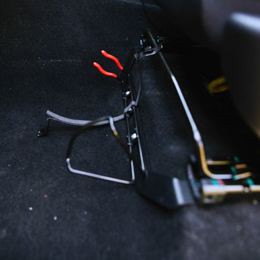 Scrub King matte black fire extinguisher bracket mounted on GWM Cannon passenger seat rail