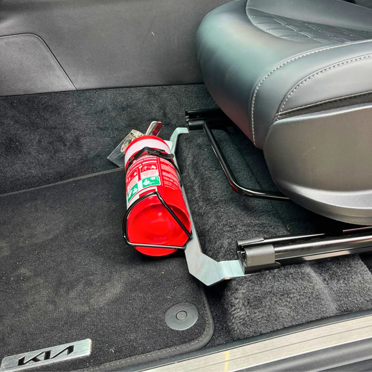 Scrub King matte black fire extinguisher bracket mounted on Kia Tasman passenger seat rail
