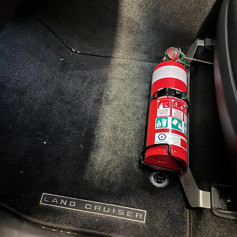 Load image into Gallery viewer, Scrub King fire extinguisher bracket fitted to Toyota LandCruiser 300 Series passenger seat rail, matte black
