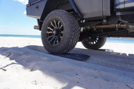 MAXTRAX XTREME Gunmetal Grey recovery boards in use under 4WD tyre off-road