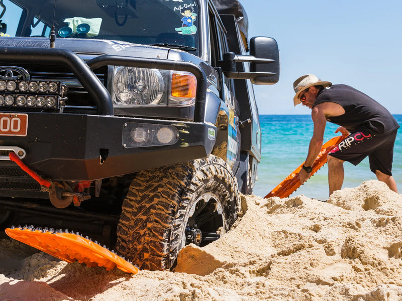 Load image into Gallery viewer, MAXTRAX XTREME Signature Orange recovery boards in use under 4WD tyre in mud
