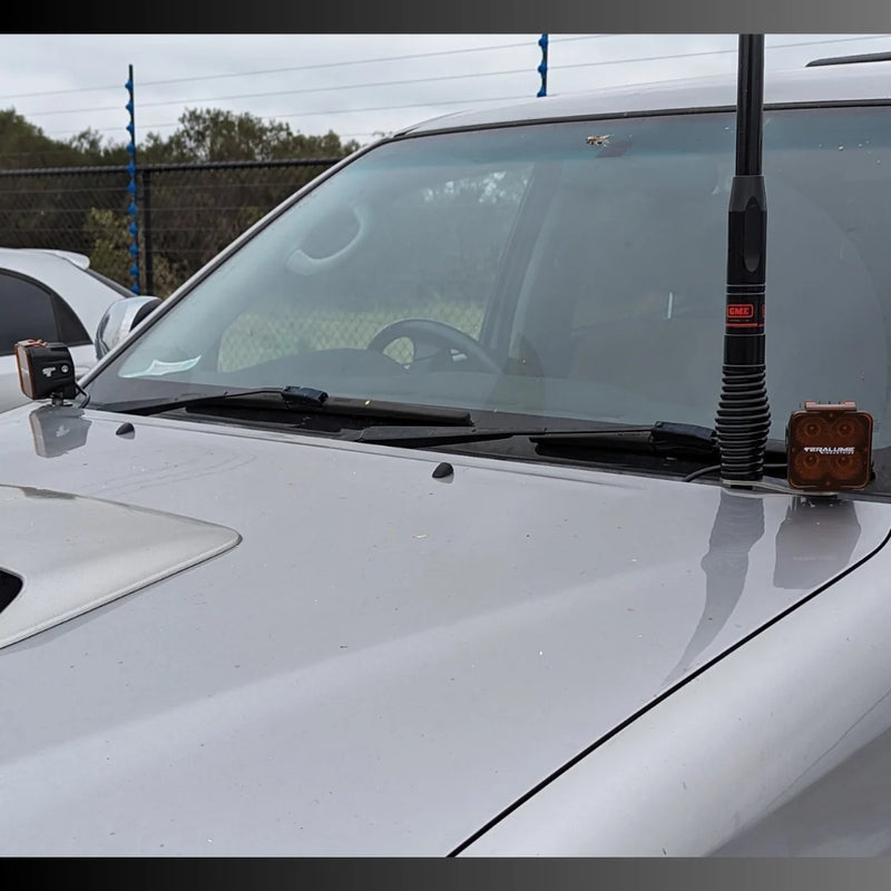 Load image into Gallery viewer, Close-up of Scrub King ditch light bracket mounted to Hilux N70 bonnet hinge – no drill required

