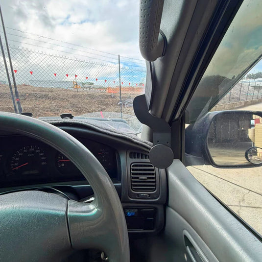 Heavy-duty magnetic phone mount securing smartphone on rough 4WD terrain and corrugated roads