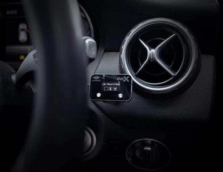 Load image into Gallery viewer, evcX driver interface dimensions 51mm x 32mm x 8mm shown next to Toyota Prado dash mount
