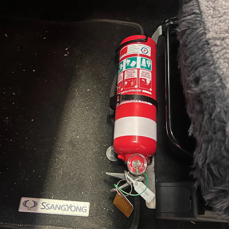 Load image into Gallery viewer, SsangYong Musso 2019–On Passenger Seat Rail Fire Extinguisher Bracket Matte Black No-Drill 4WD Mount
